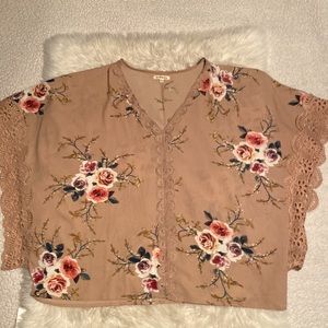 Oversized beige colored top with floral pattern size small